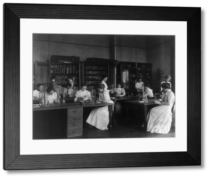 Framed Print : Girls in a science laboratory at Eastern High School, Washington, D.C. (1899?). Creator: Frances Benjamin Johnston Framed Print : Girls in a science laboratory at Eastern High School, Washington, D.C. (1899?). Creator: Frances Benjamin Johnston