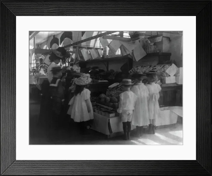 Framed Print : Woman schoolteacher and group of young pupils examining fruits and vegetab...Washington DC. (1899?). Creator: Frances Benjamin Johnston Framed Print : Woman schoolteacher and group of young pupils examining fruits and vegetab...Washington DC. (1899?). Creator: Frances Benjamin Johnston