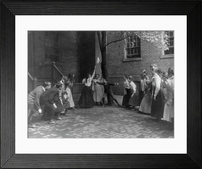 Framed Print : Children playing game with handkerchief on stick in school yard, Washington, D.C. (1899?). Creator: Frances Benjamin Johnston Framed Print : Children playing game with handkerchief on stick in school yard, Washington, D.C. (1899?). Creator: Frances Benjamin Johnston