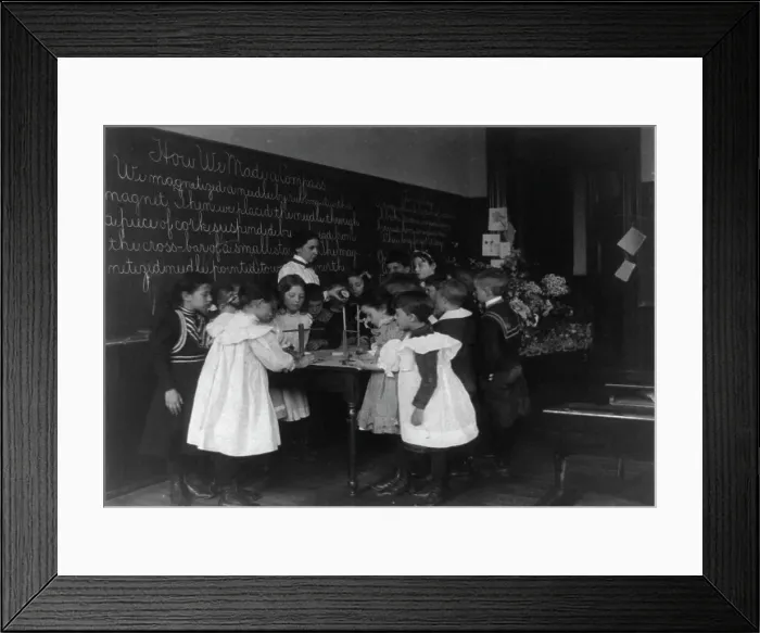 Framed Print : Children in school in Washington, D.C. - learning how a compass is made, (1899?). Creator: Frances Benjamin Johnston Framed Print : Children in school in Washington, D.C. - learning how a compass is made, (1899?). Creator: Frances Benjamin Johnston