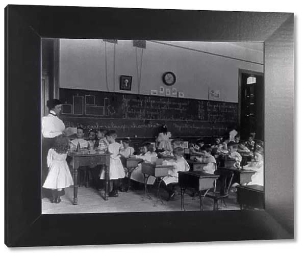 Small children studying geometry in a classroom in Washington, D.C. (1899?). Creator: Frances Benjamin Johnston