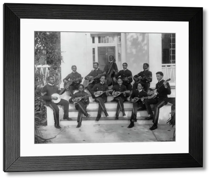 Framed Print : Hampton Institute, Hampton, Va. ca. 1898 - 11 students in uniform playing guitars... 1899 or 1900. Creator: Frances Benjamin Johnston Framed Print : Hampton Institute, Hampton, Va. ca. 1898 - 11 students in uniform playing guitars... 1899 or 1900. Creator: Frances Benjamin Johnston