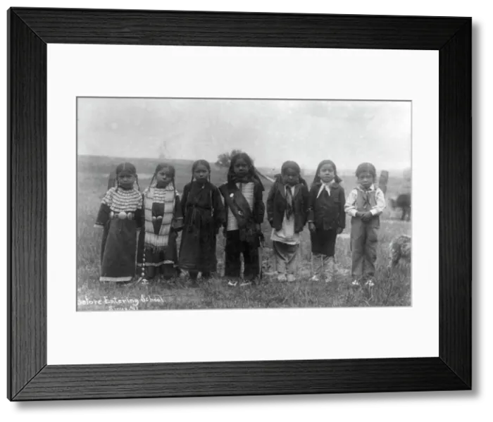 Framed Print : Hampton Institute, Hampton, Va. - before entering school - seven Indian children... 1899 or 1900. Creator: Frances Benjamin Johnston Framed Print : Hampton Institute, Hampton, Va. - before entering school - seven Indian children... 1899 or 1900. Creator: Frances Benjamin Johnston