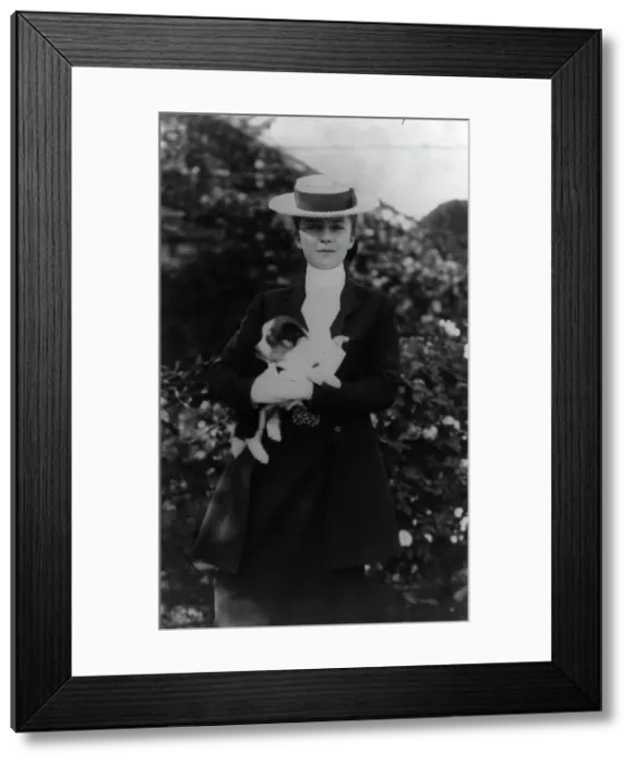 Framed Print : Alice Roosevelt in riding clothes, with dog, c1902 June 17. Creator: Frances Benjamin Johnston Framed Print : Alice Roosevelt in riding clothes, with dog, c1902 June 17. Creator: Frances Benjamin Johnston