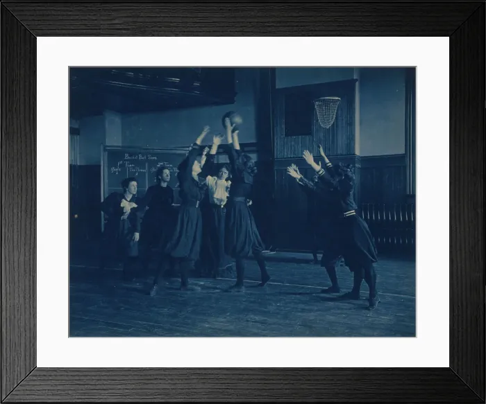 Framed Print : Female students playing basketball in a gymnasium, Western High School, Washington, D.C. (1899?). Creator: Frances Benjamin Johnston Framed Print : Female students playing basketball in a gymnasium, Western High School, Washington, D.C. (1899?). Creator: Frances Benjamin Johnston