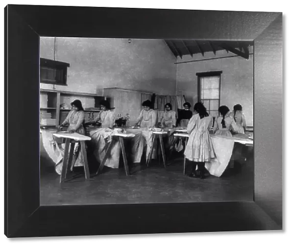 Carlisle Indian School, Carlisle, Pa. Ironing class, 1901. Creator: Frances Benjamin Johnston