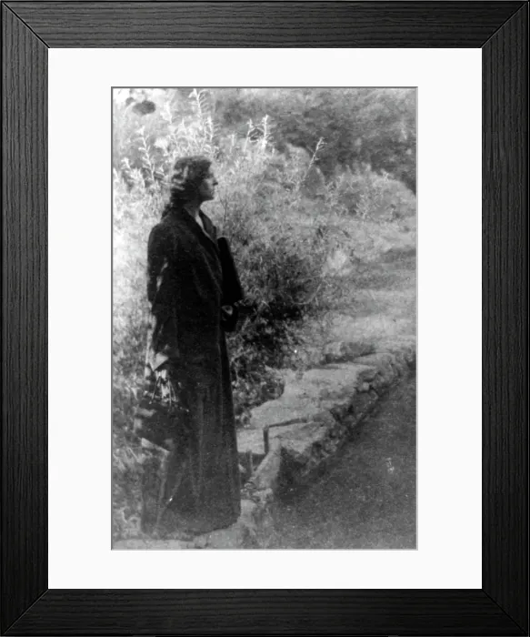 Framed Print : Frances Benjamin Johnston, full-length portrait, standing in garden, right profile, c1880 - 1950. Creator: Gertrude Kasebier Framed Print : Frances Benjamin Johnston, full-length portrait, standing in garden, right profile, c1880 - 1950. Creator: Gertrude Kasebier