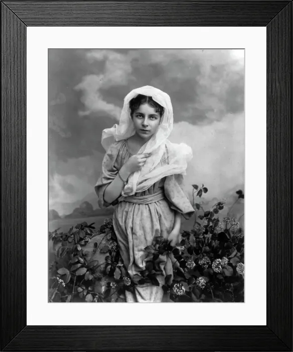 Framed Print : Girl and flowers, c1897. Creator: Minnie Libby Framed Print : Girl and flowers, c1897. Creator: Minnie Libby
