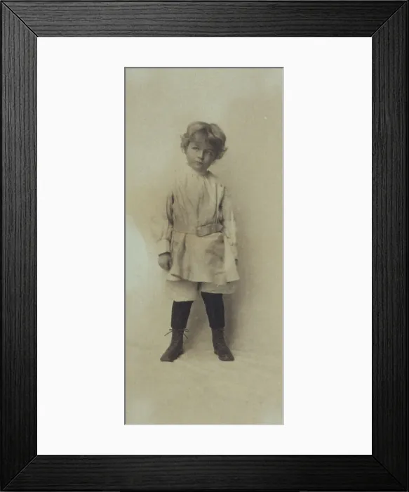 Framed Print : Portrait of a young boy standing in short pants and belted shirt, c1900. Creator: Misses Selby Framed Print : Portrait of a young boy standing in short pants and belted shirt, c1900. Creator: Misses Selby