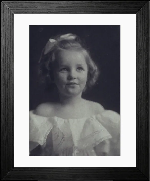 Framed Print : Young girl in a white off-the-shoulder dress with a ribbon in her hair, c1900. Creator: Anne K Pilsbury Framed Print : Young girl in a white off-the-shoulder dress with a ribbon in her hair, c1900. Creator: Anne K Pilsbury