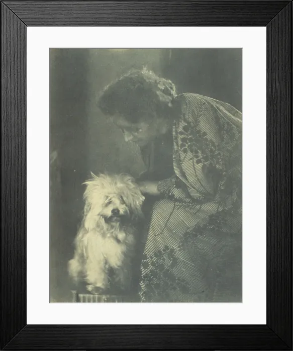 Framed Print : Seated woman petting her white dog, c1900. Creator: Virginia M Prall Framed Print : Seated woman petting her white dog, c1900. Creator: Virginia M Prall