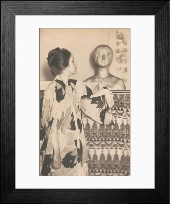 Framed Print : Woman wearing a kimono, standing, looking at a sculpted bust, c1900. Creator: Eva Watson-Schutze Framed Print : Woman wearing a kimono, standing, looking at a sculpted bust, c1900. Creator: Eva Watson-Schutze