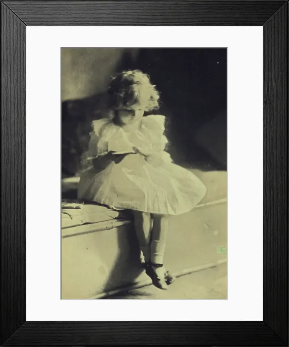 Framed Print : Seated girl reading a book, c1900. Creator: Eva Watson-Schutze Framed Print : Seated girl reading a book, c1900. Creator: Eva Watson-Schutze
