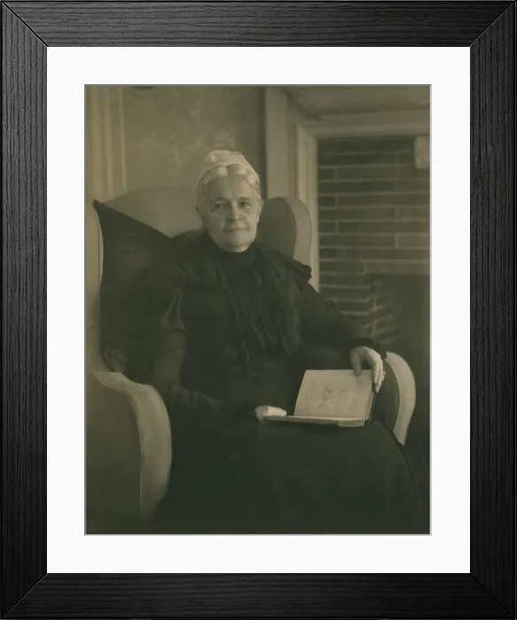 Framed Print : Old woman in an armchair, with an open book in her lap, c1900. Creator: Mathilde Weil Framed Print : Old woman in an armchair, with an open book in her lap, c1900. Creator: Mathilde Weil