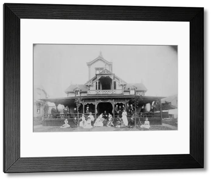 Framed Print : Frances Benjamin Johnston and family on porch and in front of house, between 1890 and 1910. Creator: Unknown Framed Print : Frances Benjamin Johnston and family on porch and in front of house, between 1890 and 1910. Creator: Unknown