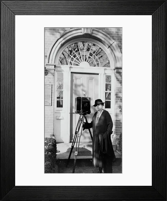 Framed Print : Frances Benjamin Johnston, full-length portrait, standing in front of door, with camera... c1935. Creator: Unknown Framed Print : Frances Benjamin Johnston, full-length portrait, standing in front of door, with camera... c1935. Creator: Unknown