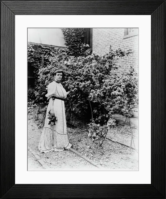 Framed Print : Frances Benjamin Johnston, full-length portrait, standing in her garden... c1890 - 1910. Creator: Unknown Framed Print : Frances Benjamin Johnston, full-length portrait, standing in her garden... c1890 - 1910. Creator: Unknown