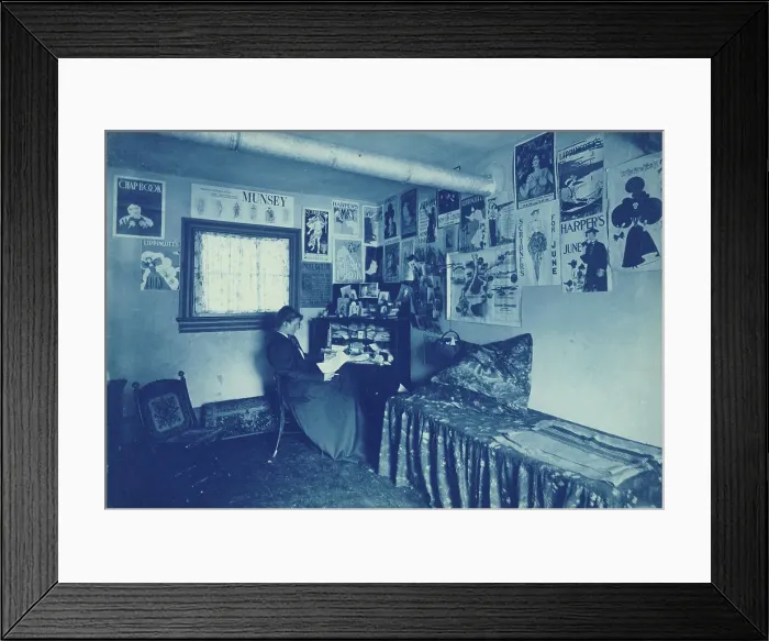 Framed Print : Frances Benjamin Johnston seated at a desk in her studio / office, with adverstising... c1896. Creator: Frances Benjamin Johnston