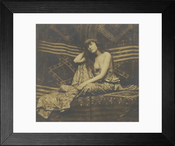 Framed Print : Portrait of a woman, partially draped, seated on a sofa, 1900. Creator: Unknown Framed Print : Portrait of a woman, partially draped, seated on a sofa, 1900. Creator: Unknown