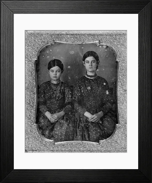 Framed Print : Group portrait of two unidentified girls, three-quarter length, seated, facing front, c1840 - 1860. Creator: Unknown Framed Print : Group portrait of two unidentified girls, three-quarter length, seated, facing front, c1840 - 1860. Creator: Unknown