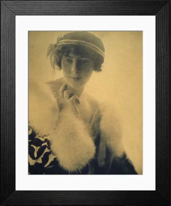 Framed Print : Half-length portrait of a woman wearing a fur trimmed coat, facing front, between 1900 and 1920. Creator: Unknown
