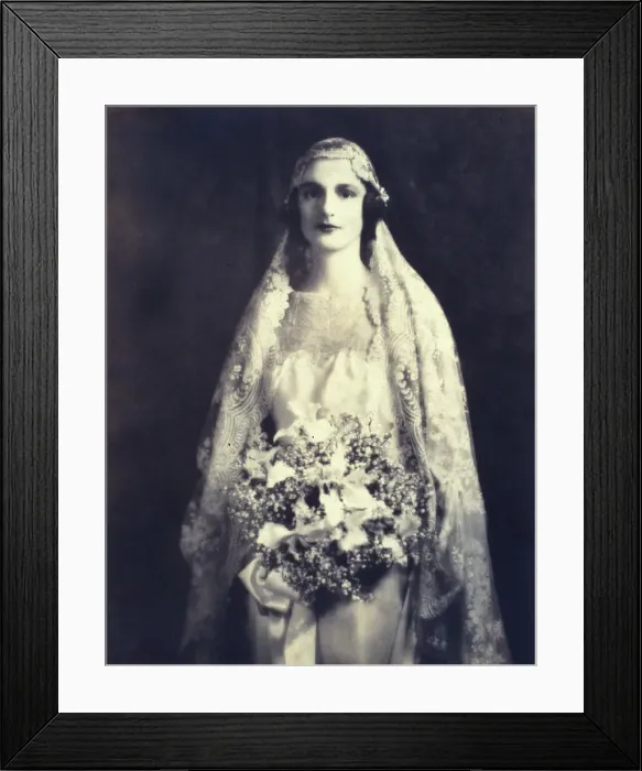 Framed Print : Bride holding a wedding bouquet, facing front, three-quarter length portrait, between 1920 and 1930. Creator: Unknown Framed Print : Bride holding a wedding bouquet, facing front, three-quarter length portrait, between 1920 and 1930. Creator: Unknown
