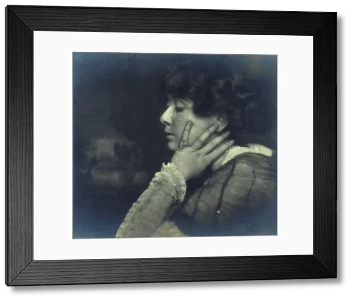 Framed Print : Woman resting her head on her left hand, head-and-shoulders profile portrait, c1900. Creator: Unknown Framed Print : Woman resting her head on her left hand, head-and-shoulders profile portrait, c1900. Creator: Unknown