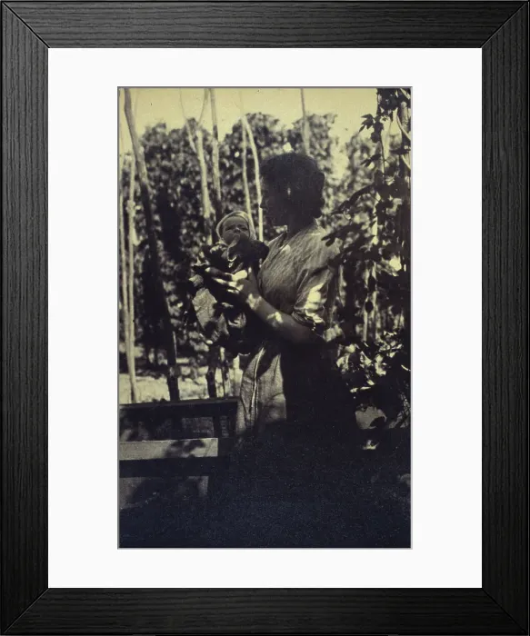 Framed Print : Woman holding an infant outdoors, between 1920 and 1940. Creator: Unknown Framed Print : Woman holding an infant outdoors, between 1920 and 1940. Creator: Unknown