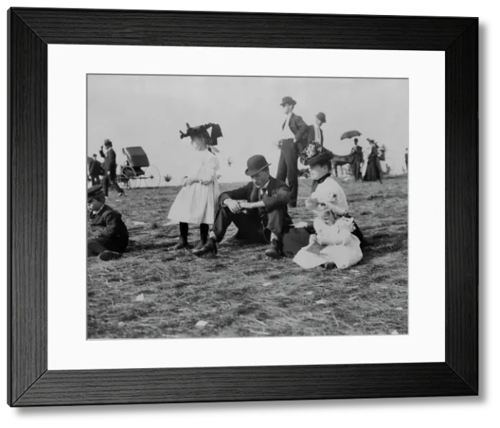 Framed Print : Parents and children seated on grass at state fair, St. Paul, Minnesota, 1900?. Creator: Unknown Framed Print : Parents and children seated on grass at state fair, St. Paul, Minnesota, 1900?. Creator: Unknown