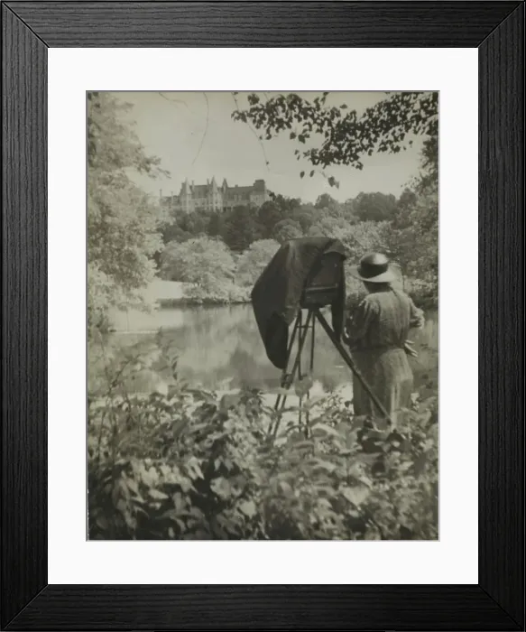 Framed Print : Photographer Frances Benjamin Johnston standing beside her large view camera looking... c1938. Creator: Unknown Framed Print : Photographer Frances Benjamin Johnston standing beside her large view camera looking... c1938. Creator: Unknown