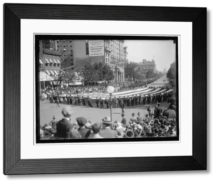 Framed Print : Parade On Pennsylvania Ave - Huge Flag, between 1910 and 1921. Creator: Harris & Ewing. Parade On Pennsylvania Ave - Huge Flag, between 1910 and 1921. Creator: Harris & Ewing