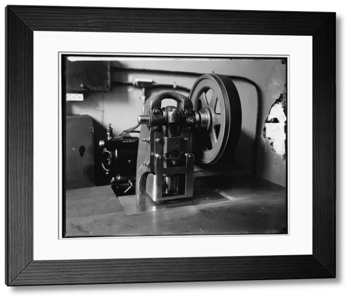 Framed Print : Stamping machine at Treasury, between 1910 and 1920. Creator: Harris & Ewing. Stamping machine at Treasury, between 1910 and 1920. Creator: Harris & Ewing Framed Print : Stamping machine at Treasury, between 1910 and 1920. Creator: Harris & Ewing. Stamping machine at Treasury, between 1910 and 1920. Creator: Harris & Ewing