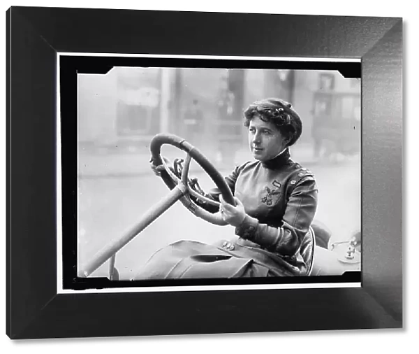 Race car driver Joan Newton Cuneo, seated in racing car, facing left, between 1910 and 1917. Creator: Harris & Ewing. Race car driver Joan Newton Cuneo, seated in racing car, facing left, between 1910 and 1917. Creator: Harris & Ewing