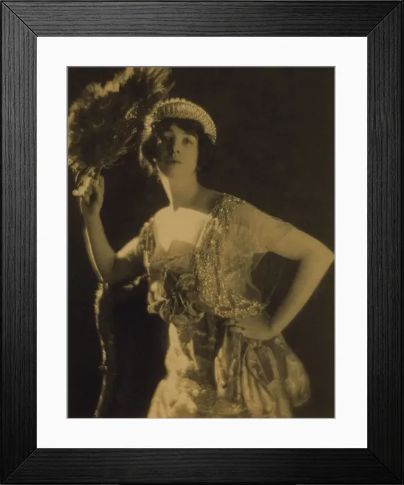 Framed Print : Three-quarter length portrait of Gertrude Vanderbilt Whitney...holding a peacock feather fan, c1916. Creator: Adolph de Meyer Framed Print : Three-quarter length portrait of Gertrude Vanderbilt Whitney...holding a peacock feather fan, c1916. Creator: Adolph de Meyer