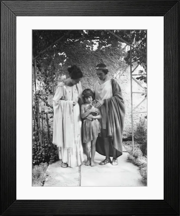 Framed Print : Kanellos, Vanellos and Tanagra, and child holding a cat, in dance costumes, 1929 Creator: Arnold Genthe Framed Print : Kanellos, Vanellos and Tanagra, and child holding a cat, in dance costumes, 1929 Creator: Arnold Genthe