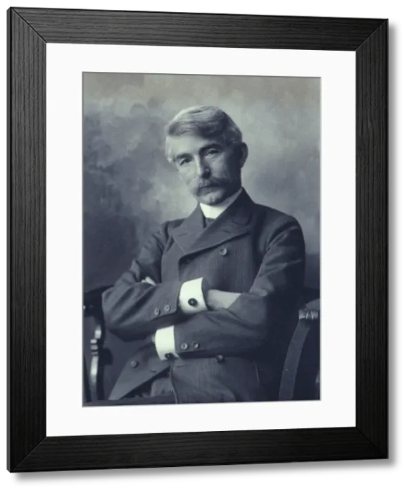 Framed Print : Portrait of man wearing a pinstripe suit seated with his arms crossed, c1900. Creator: Fannie L. Elton Framed Print : Portrait of man wearing a pinstripe suit seated with his arms crossed, c1900. Creator: Fannie L. Elton