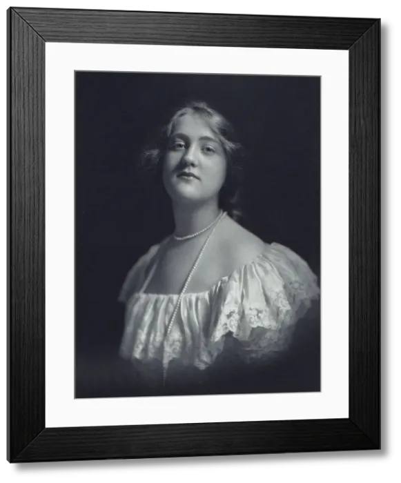 Framed Print : Young woman wearing an off-the-shoulder dress and long pearl necklace, looking front... c1900. Creator: F. Gercher Framed Print : Young woman wearing an off-the-shoulder dress and long pearl necklace, looking front... c1900. Creator: F. Gercher