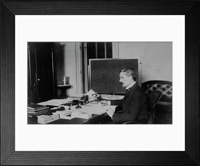 Framed Print : Dr. Miller, Treasury Department employee, half-length portrait, seated at... between 1884 and 1930. Creator: Frances Benjamin Johnston Framed Print : Dr. Miller, Treasury Department employee, half-length portrait, seated at... between 1884 and 1930. Creator: Frances Benjamin Johnston