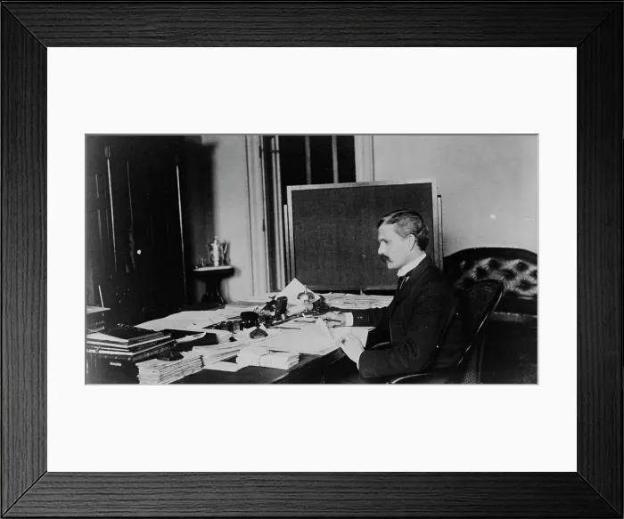 Framed Print : Dr. Miller, Treasury Department employee, half-length portrait, seated at... between 1884 and 1930. Creator: Frances Benjamin Johnston Framed Print : Dr. Miller, Treasury Department employee, half-length portrait, seated at... between 1884 and 1930. Creator: Frances Benjamin Johnston