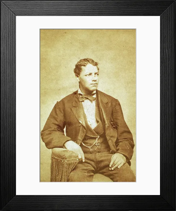 Framed Print : Studio portrait of unidentified seated young man, his left arm resting on chair, c1870-c1879. Creator: Unknown Framed Print : Studio portrait of unidentified seated young man, his left arm resting on chair, c1870-c1879. Creator: Unknown