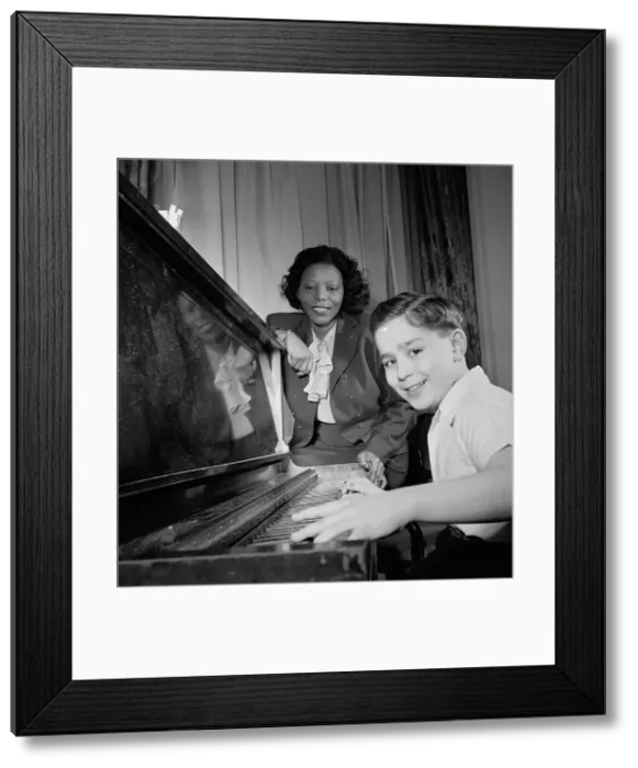 Framed Print : Portrait of Mary Lou Williams and Roger Barnet, Waldorf-Astoria, Suite 4-B, New York, N.Y. 1947. Creator: William Paul Gottlieb Framed Print : Portrait of Mary Lou Williams and Roger Barnet, Waldorf-Astoria, Suite 4-B, New York, N.Y. 1947. Creator: William Paul Gottlieb