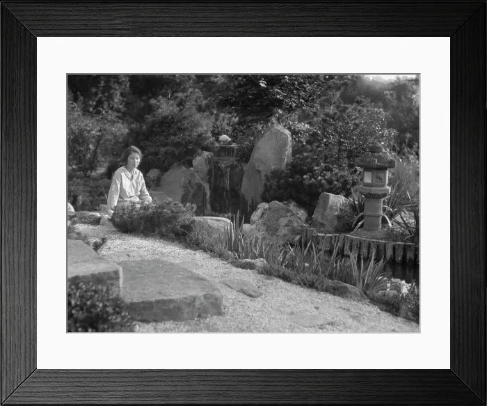 Framed Print : Unidentified woman seated in a garden next to a stream, possibly belonging to A.W. Bahr, c 1917-1934 Creator: Arnold Genthe Framed Print : Unidentified woman seated in a garden next to a stream, possibly belonging to A.W. Bahr, c 1917-1934 Creator: Arnold Genthe