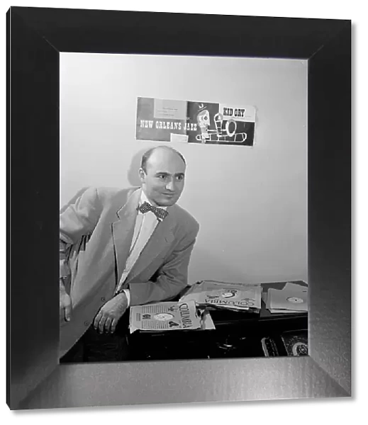 Portrait of George Avakian in his office or home, New York, N.Y.(?), 1938. Creator: William Paul Gottlieb
