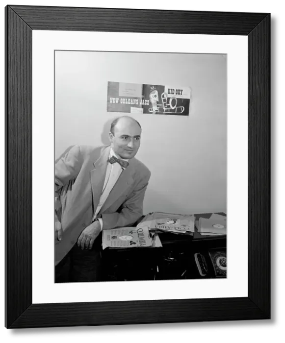 Framed Print : Portrait of George Avakian in his office or home, New York, N.Y.(?), 1938. Creator: William Paul Gottlieb Framed Print : Portrait of George Avakian in his office or home, New York, N.Y.(?), 1938. Creator: William Paul Gottlieb