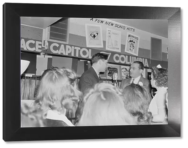 Portrait of Tommy Dorsey and William P. Gottlieb, record store, Washington, D.C. ca. 1940. Creator: Delia Potofsky Gottlieb