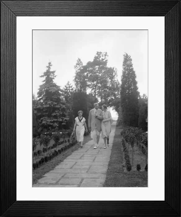 Framed Print : Edge, Charles N. walking with Margaret Edge and another woman in his garden, 1932 or 1933. Creator: Arnold Genthe Framed Print : Edge, Charles N. walking with Margaret Edge and another woman in his garden, 1932 or 1933. Creator: Arnold Genthe
