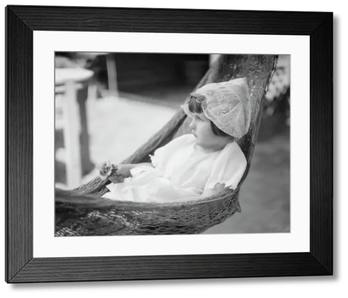 Framed Print : Rice, Isaac, Mrs. grandaughter of, in a hammock, 1920 July 26. Creator: Arnold Genthe Framed Print : Rice, Isaac, Mrs. grandaughter of, in a hammock, 1920 July 26. Creator: Arnold Genthe