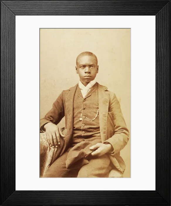 Framed Print : Studio portrait of unidentified seated young man, holding cap, c1880-c1889. Creator: A. H. Plecker Framed Print : Studio portrait of unidentified seated young man, holding cap, c1880-c1889. Creator: A. H. Plecker