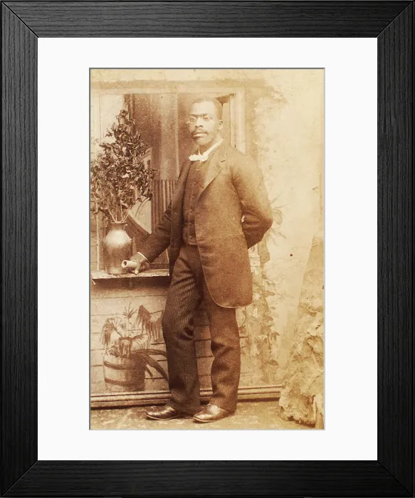 Framed Print : Full-length portrait of man, with studio props, c1880-c1889. Creator: Richmond Photograph Co Framed Print : Full-length portrait of man, with studio props, c1880-c1889. Creator: Richmond Photograph Co