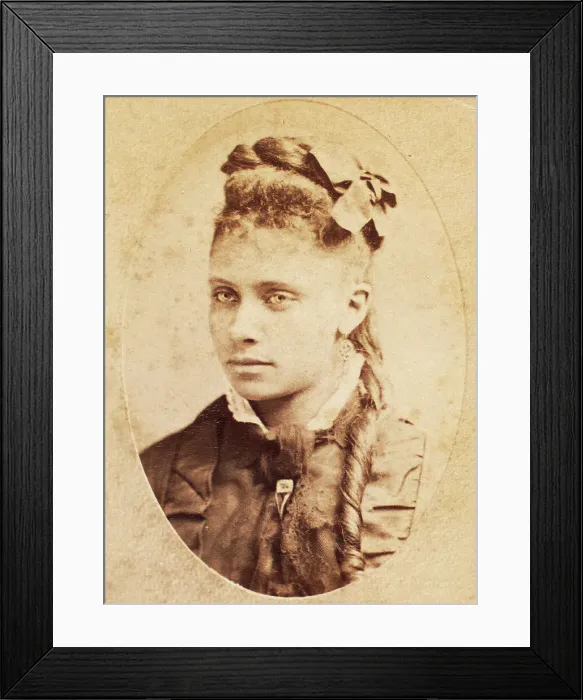 Framed Print : Oval portrait of unidentified young woman with long curl draped over chest. c1880-c1889. Creator: Unknown Framed Print : Oval portrait of unidentified young woman with long curl draped over chest. c1880-c1889. Creator: Unknown